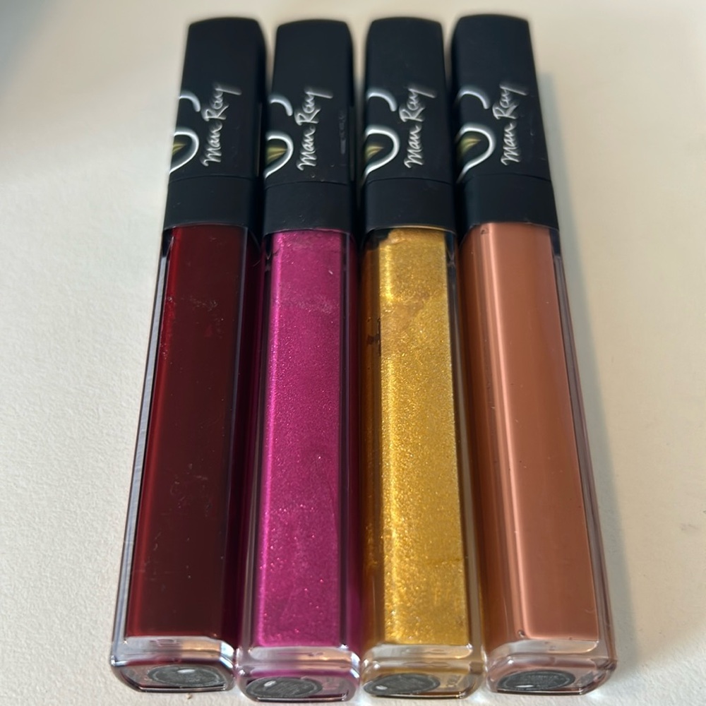 Set of 4 NARS Man Ray lip glosses.